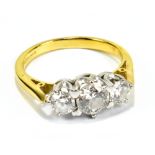 An 18ct yellow gold three stone diamond ring, the central stone approx 0.50cts, size M 1/2, approx