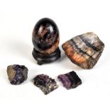 A Derbyshire fluorspar 'Blue John' egg on associated ebonised stand and four further samples of Blue