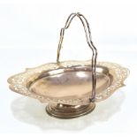 ALEXANDER CLARK & CO; a George V hallmarked silver swing handled basket with pierced border,