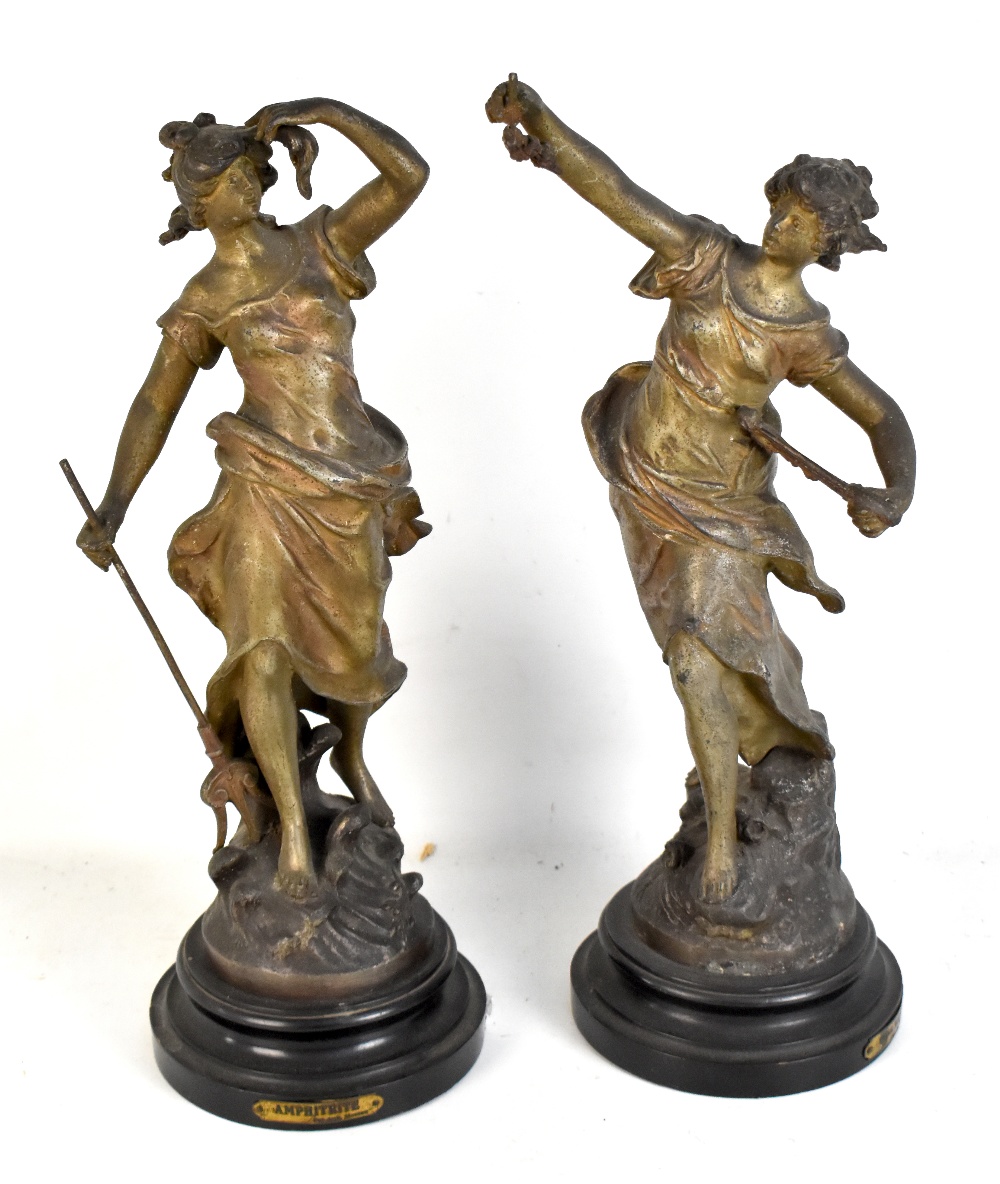 AFTER MOREAU; a pair of spelter figures, 'Poésie d'Automne' and 'Aphrodite', each on a turned wooden