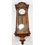 A walnut cased Vienna style wall clock, the circular enamel dial set with Roman numerals and