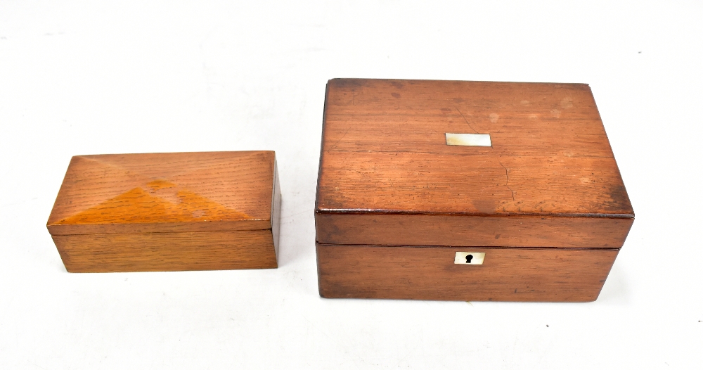 A Victorian mahogany sewing box, length 22cm, and an early 20th century oak rectangular casket,