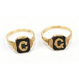 Two 9ct yellow gold onyx mourning rings, with gold mounted initials, approx 4.1g.