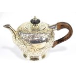RICHARD FREEMAN; a rare George II English provincial bullet shaped teapot with later floral embossed