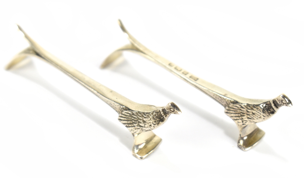 BISHTON'S LTD; a pair of Elizabeth II hallmarked silver pheasant knife rests, length 10cm,