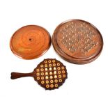 A Victorian rosewood games board with various pegs, length 24cm, and two circular games boards (3).