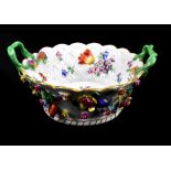 MEISSEN; a mid-19th century floral encrusted and painted lattice effect basket with twin twisted