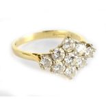 An 18ct yellow gold nine stone diamond cluster ring, the diamonds totalling approx 1.70cts, ring