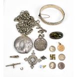 A small group of costume jewellery to include a hallmarked silver snap bangle, a hallmarked silver