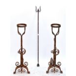 A pair of modern reproduction iron andirons, height 89cm, and a fire poker (3).