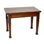 An early 20th century oak foldover table raised on tapering block supports, width 98cm.