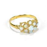 A 9ct gold opal set ring, with nine central opals, size P to Q, approx 1.7g.