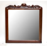 A reproduction carved wall mirror, height 89cm.