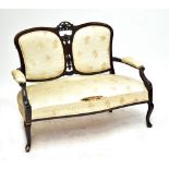 An Edwardian mahogany upholstered two seater sofa with carved back on front cabriole legs, length