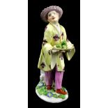 MEISSEN; a mid-18th century figure of a Chinese gentleman carrying an oval tray of fruit, height