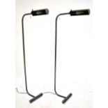 A pair of freestanding bronzed metal picture lights, height 110cm (2).