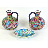 LONGWY; a pair of French small enamelled floral motif jugs, both no.1086, height 11cm, and a