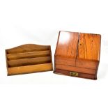 A walnut veneered sloping stationery box with twin hinged doors and single drawer, 28 x 31cm, and