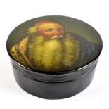 A Russian circular papier-mâché box and cover painted with a bearded gentleman, diameter 12cm.