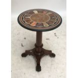 A 19th century circular specimen marble table top with sunburst style decoration, indistinct paper