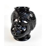 An unusual American black glass cookie jar modelled as the bust of a lady, unmarked, height 20cm.