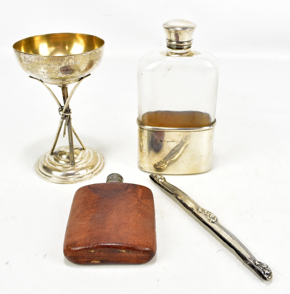 A Victorian hallmarked silver and clear moulded glass hip flask, the cup hallmarked for London 1882,