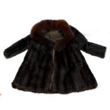 A mink dyed fur coat with fox fur collar.