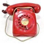 A red bakelite telephone stamped 'GPO Batch Sampled 8532' to base.Additional InformationDial spins