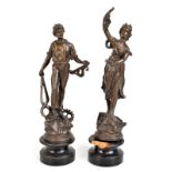 A pair of early 20th century spelter figures modelled as a blacksmith and maiden, each on wooden