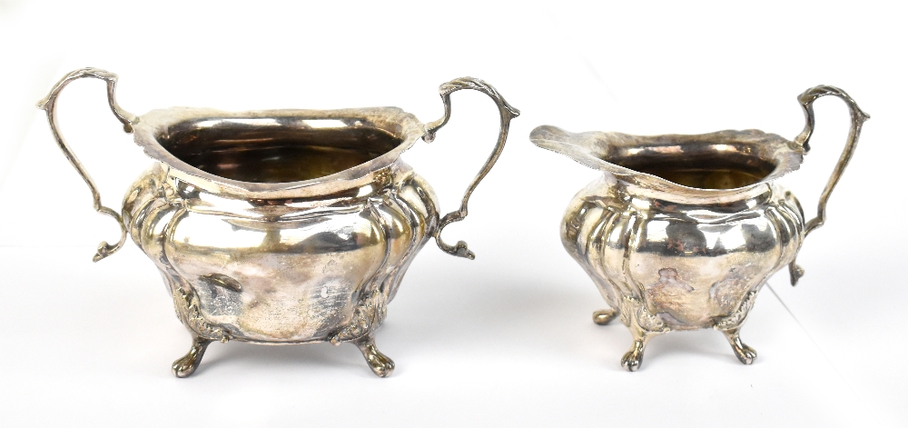 FENTON & RUSSELL CO LTD; an Edward VII hallmarked silver twin handled sugar bowl, and matching cream
