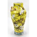 A late 19th/early 20th century Chinese yellow ground vase decorated with dragons amongst flowers,