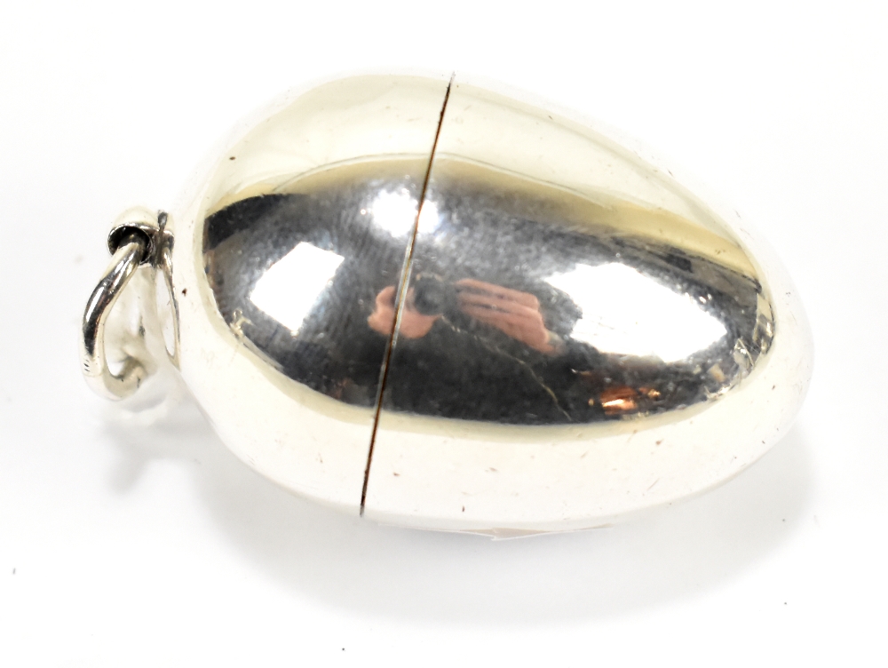 THOMAS WILLIAM DEE; a Victorian hallmarked silver egg shaped string dispenser, London 1870, approx