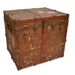 An early 20th century canvas and leather rectangular steamer trunk with strap work detail, twin