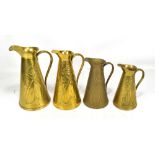 J S & S; a graduated set of four brass water jugs, all with Art Nouveau floral decoration, height of
