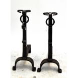 A large pair of 19th century cast iron andirons, each approx 66 x 60cm (2).