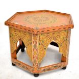 A 20th century Moroccan inspired hexagonal painted occasional table.