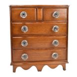 A Victorian mahogany miniature chest of two short over three long drawers with glass handles, raised