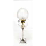 A Victorian electroplated Corinthian column oil lamp with clear glass reservoir, height 75cm.
