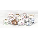 FRANKLIN MINT; a set of twelve modern porcelain teapots modelled after originals in the V&A Museum