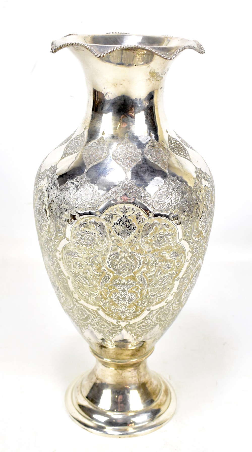 A South East Asian white metal baluster vase featuring repoussé flora and fauna decoration with