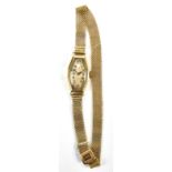 A lady's Art Deco 9ct yellow gold wristwatch, the dial set with Arabic numerals, on 9ct gold mesh