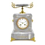 A circa 1900 French grey marble gilt metal mounted mantel clock with urn finial, the circular