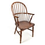 A child's Windsor elbow chair.Additional InformationIt is a 20th century example. Height of back