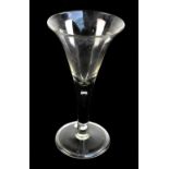A 19th century oversized drinking glass with flared trumpet bowl and folded foot, height 25cm.