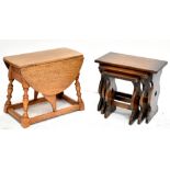 A reproduction nest of three oak tables on shaped supports and a drop leaf occasional table (2).