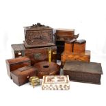 A group of treen boxes including a carved Black Forest two division tea caddy, a Tunbridge ware work