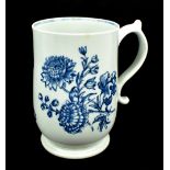 LOWESTOFT; a late 18th century bell-shape mug with 'loop and kick' handle featuring printed floral