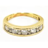 A yellow metal channel set diamond dress ring, the inner band stamped 14k, size O, approx 4g.