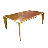 LINLEY FURNITURE; a light oak writing desk with central leather inlay and single drawer beneath