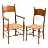 WILLIAM BIRCH FOR LIBERTY & CO; a set of five oak framed Arts and Crafts rush seated chairs, each